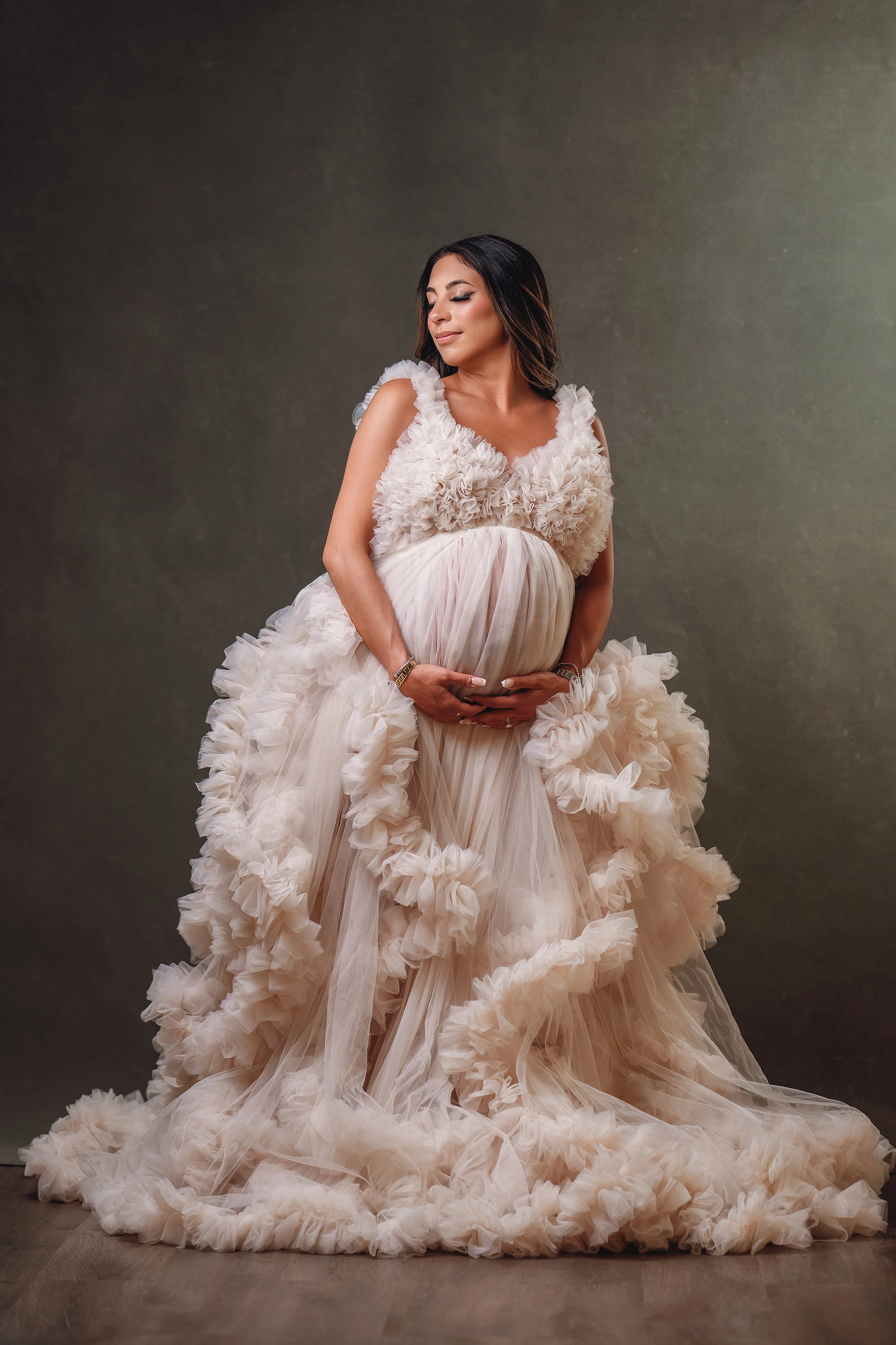 maternity photo of woman in long gown