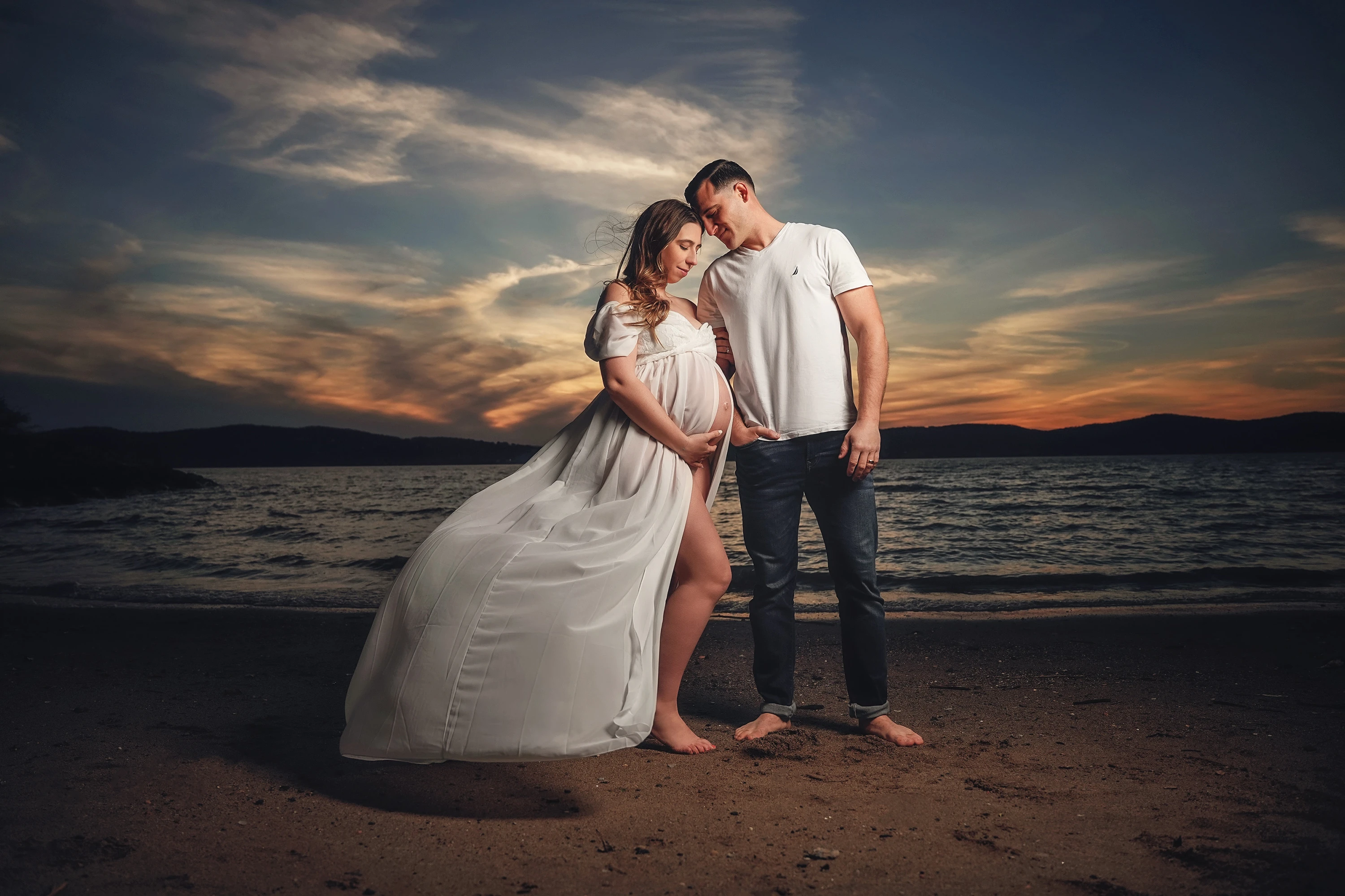 maternity photo of mana and woman posing at sunset