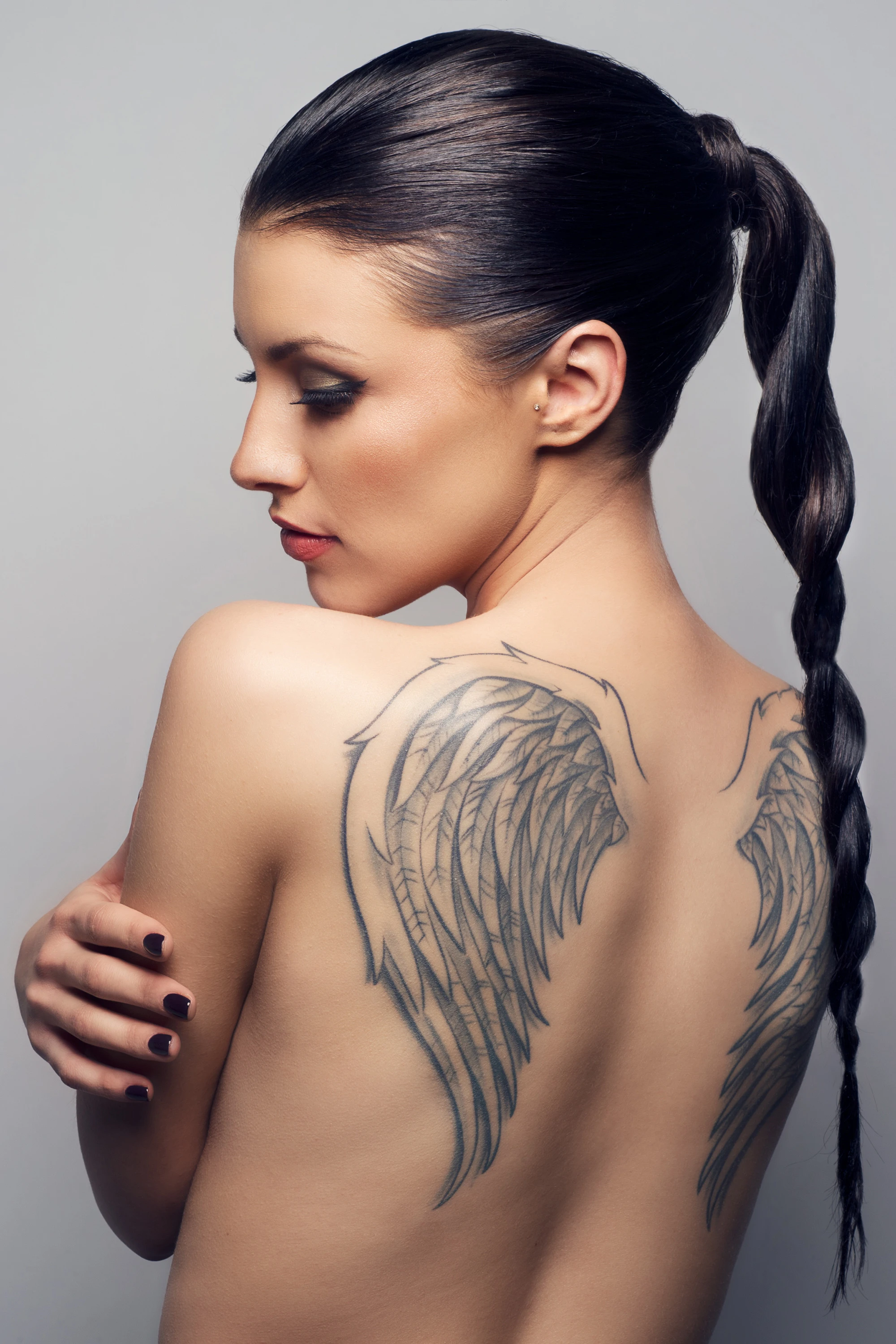 creative portrait of woman with black hair in a braid