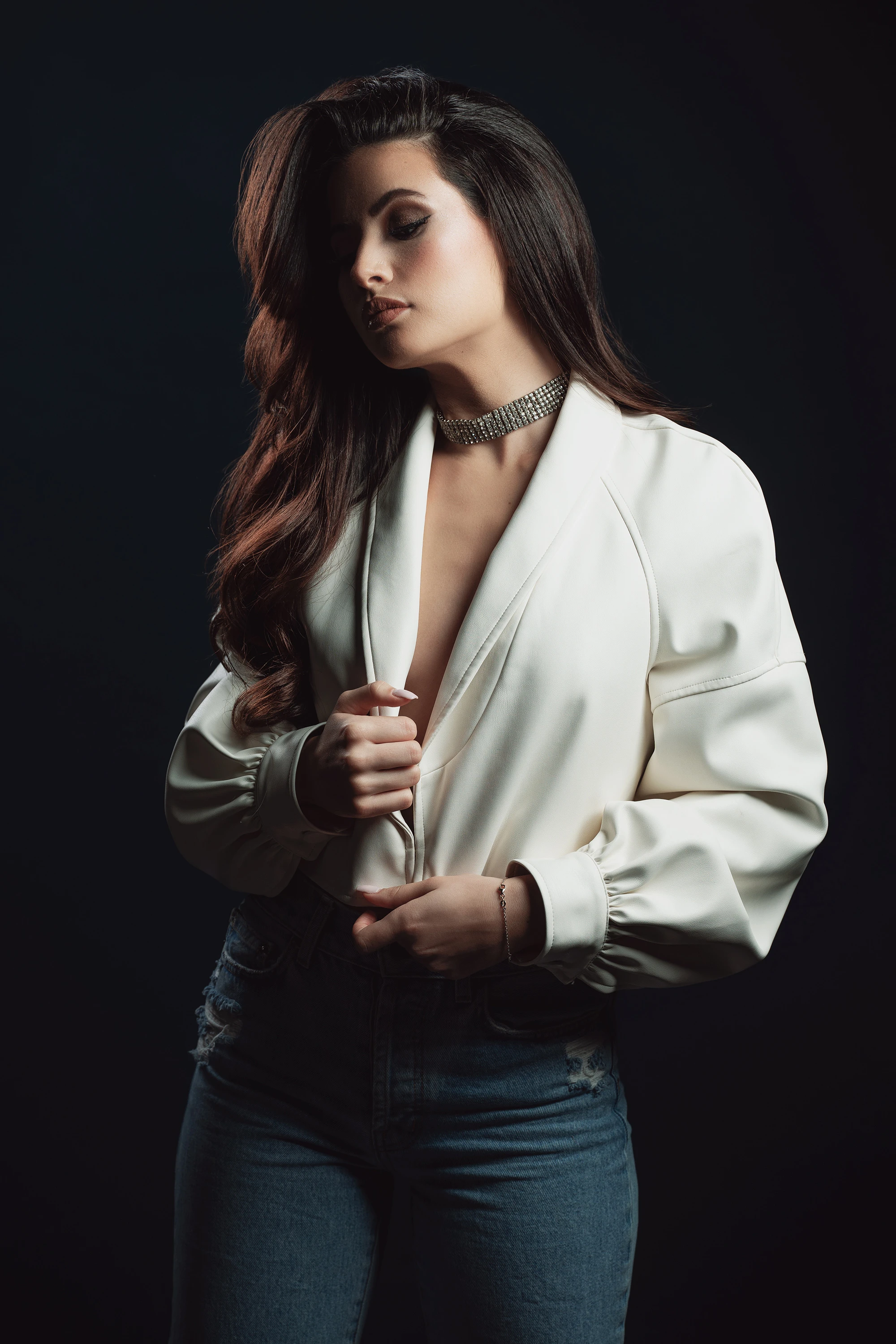 creative portrait of woman in jeans and white top