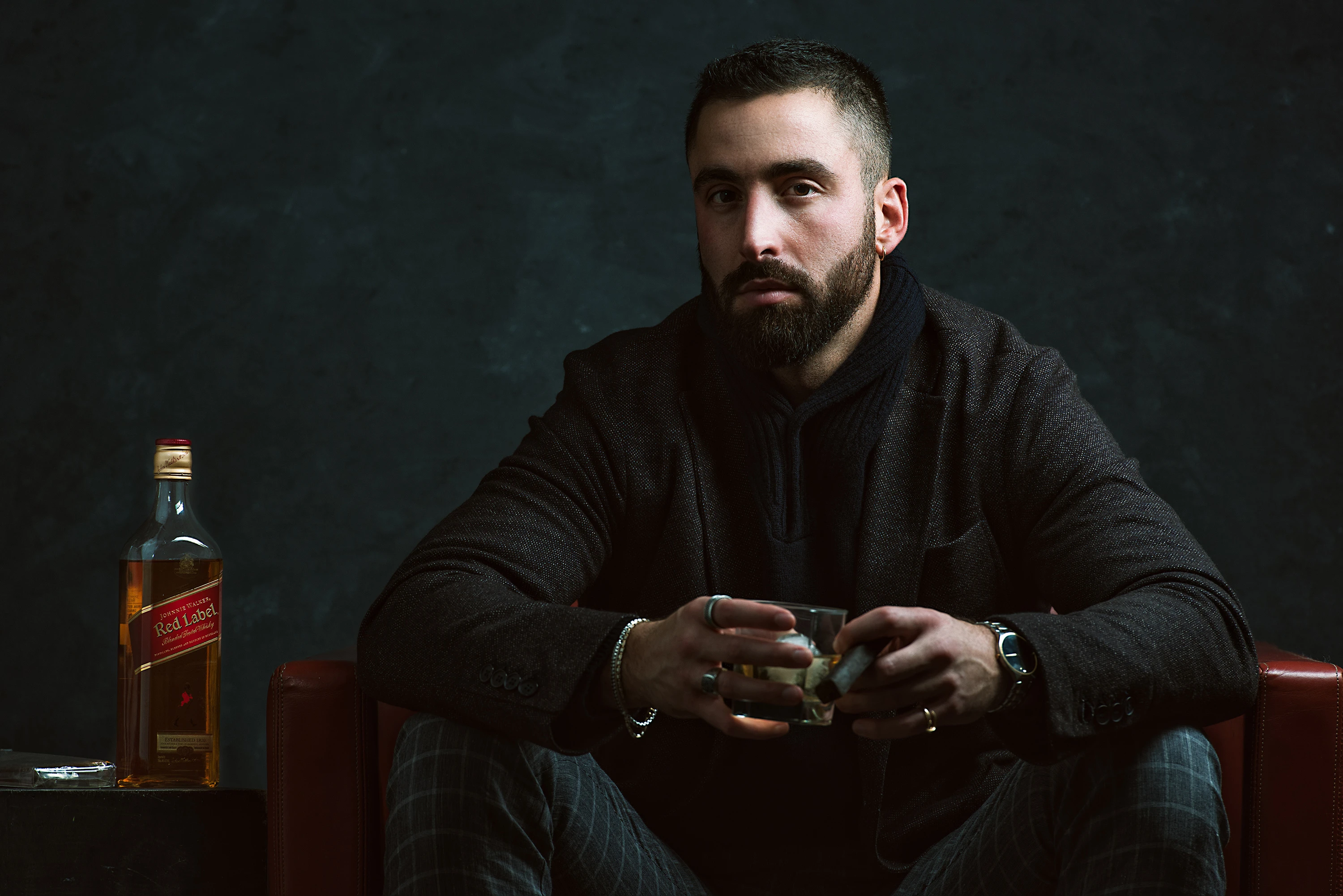 portrait of man with johnny walker whiskey
