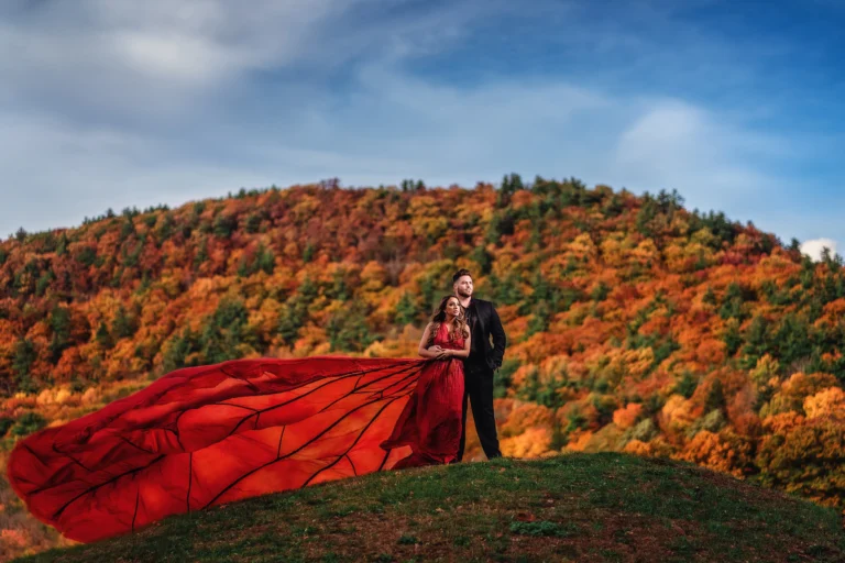 Couple posing outdoors in nature during autumn for engagement photoshoot