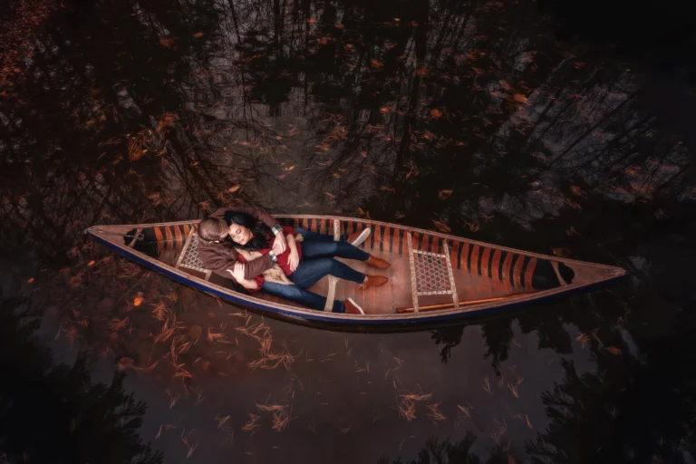 portrait of man and woman in canoe