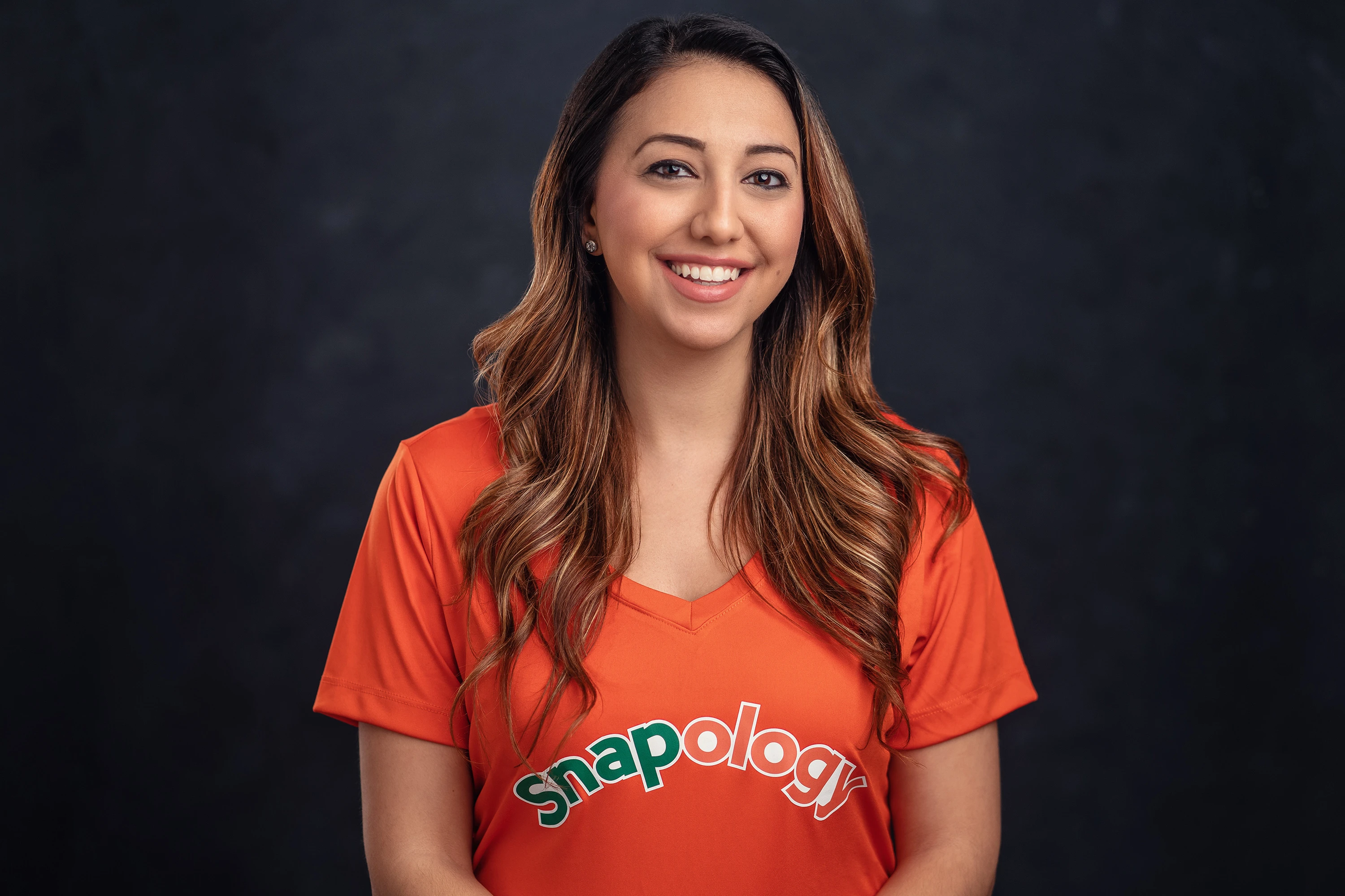 headshot of woman in snapology tshirt