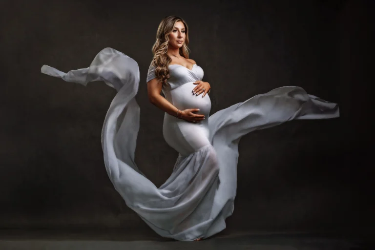 Maternity photo of woman in flowing dress